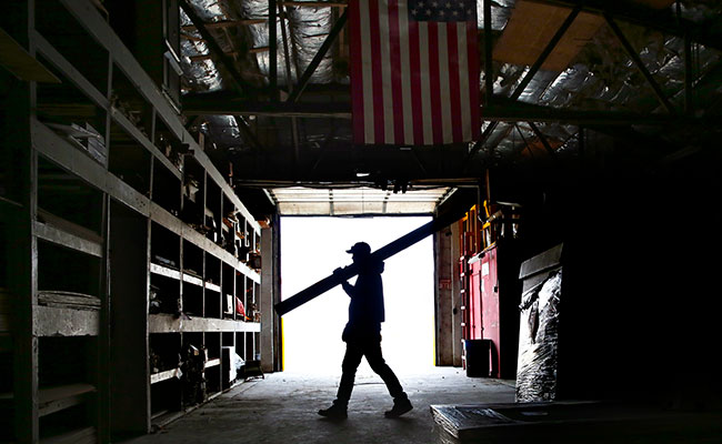 man in lumer warehouse